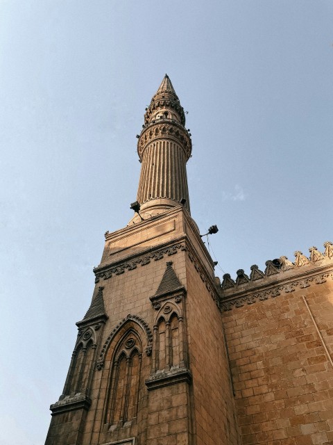 a very tall building with a clock on its side