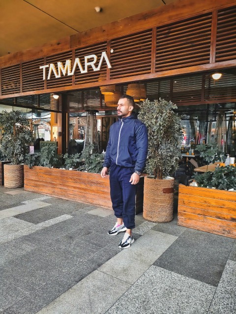 a man standing in front of a store