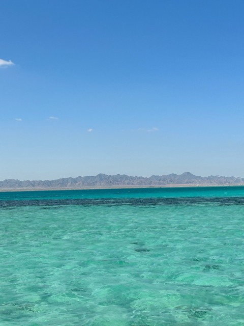 a boat floating on top of a large body of water