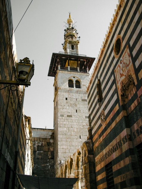 a tall clock tower towering over a city