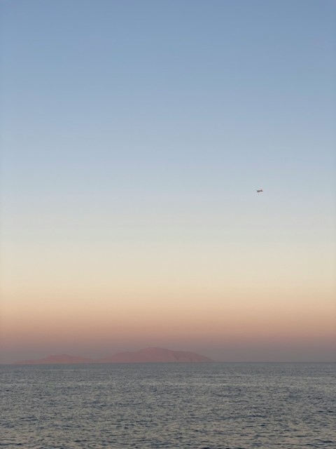 body of water under blue sky during daytime