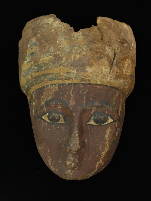 a close up of a mask on a black background