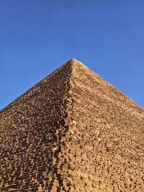 brown brick wall under blue sky during daytime