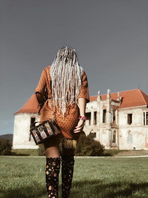 woman walking near building