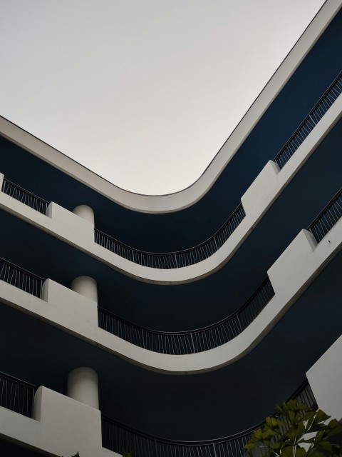 a building that has a bunch of balconies on it