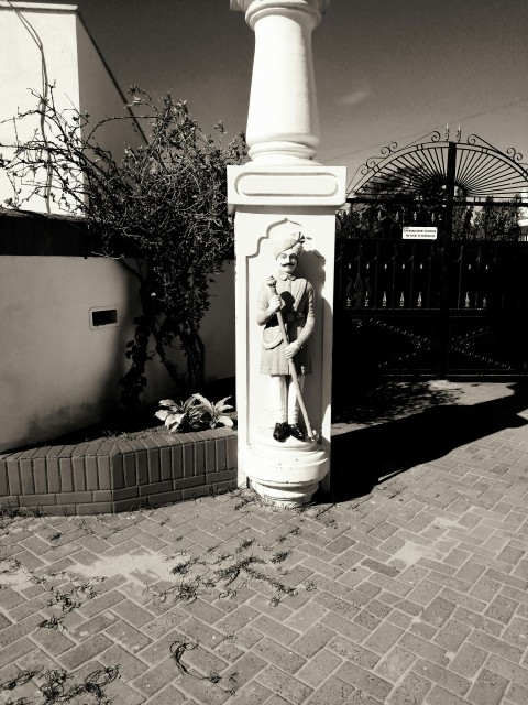 a black and white photo of a statue of a woman