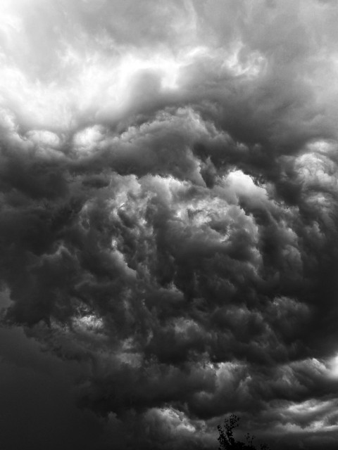 a black and white photo of storm clouds