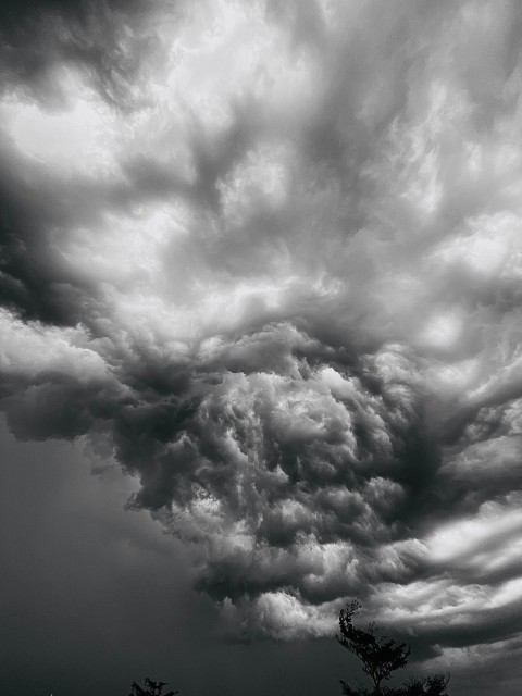 a black and white photo of storm clouds