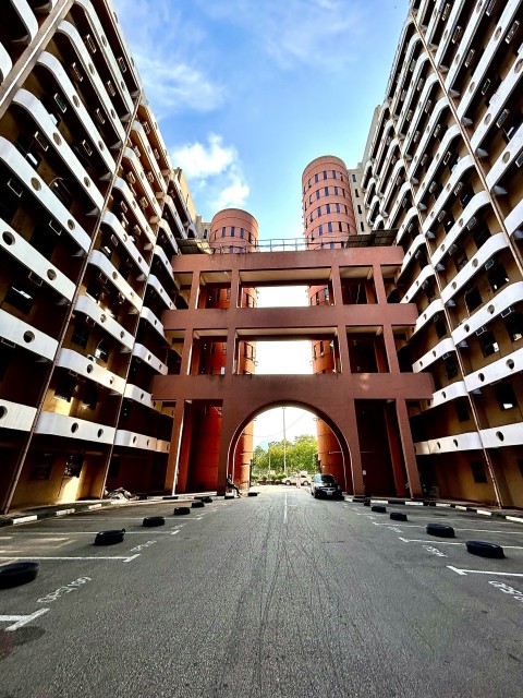 a very tall building with a very wide entrance