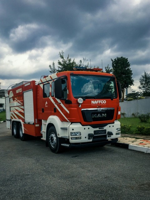 red and white fire truck on road during daytime