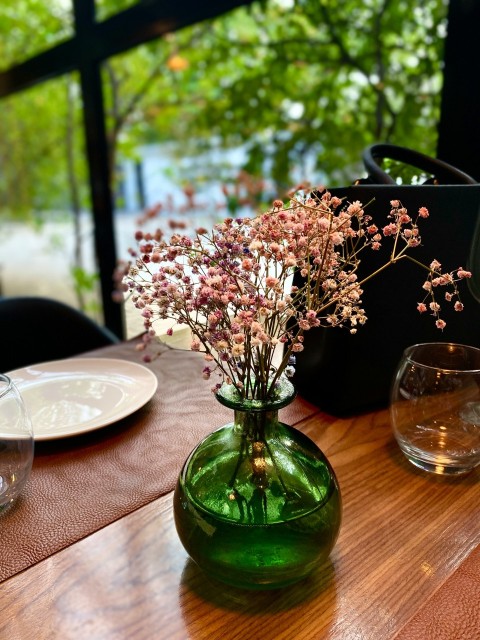 a table with a vase of flowers on it