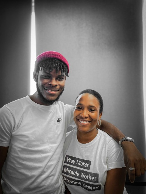 a man standing next to a woman in a bathroom