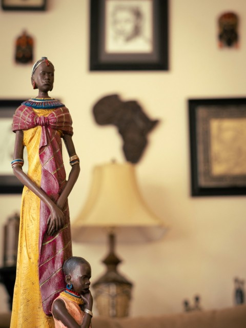 a figurine of a woman and child in a living room