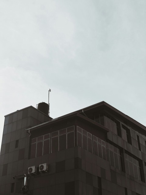 brown concrete building under white sky during daytime