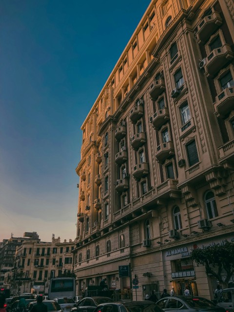 a very tall building with many windows and balconies