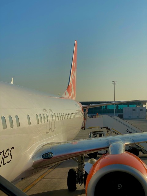 a large jetliner sitting on top of an airport tarmac