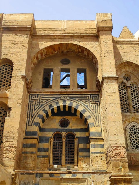 a large building with a clock on the side of it PlR