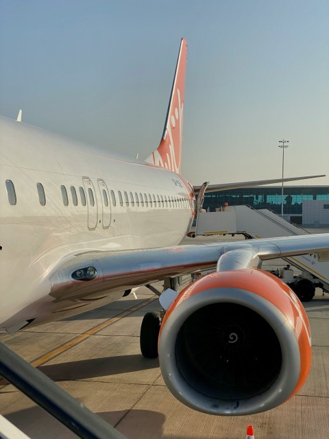 a large jetliner sitting on top of an airport tarmac