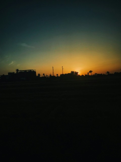 silhouette photography of houses during golden hour