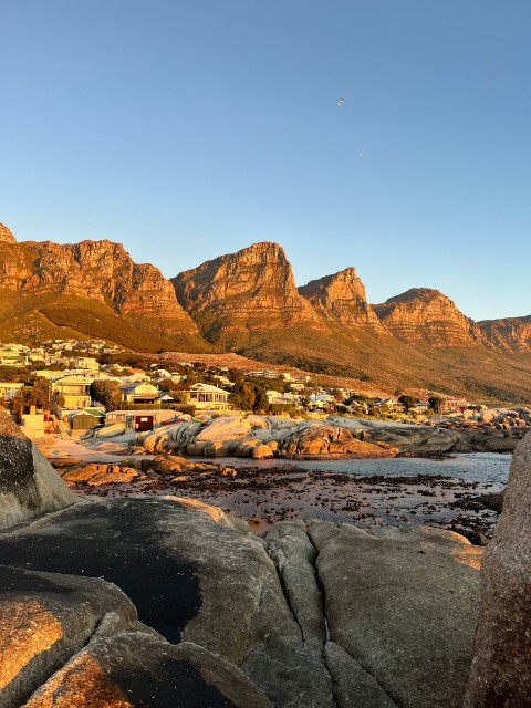 a view of some mountains and a body of water