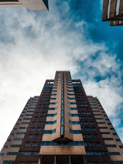 beige concrete high rise building