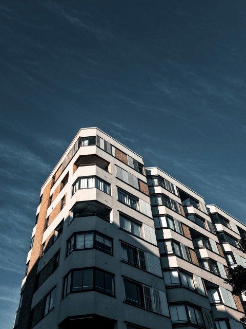 white concrete building under blue sky during daytime