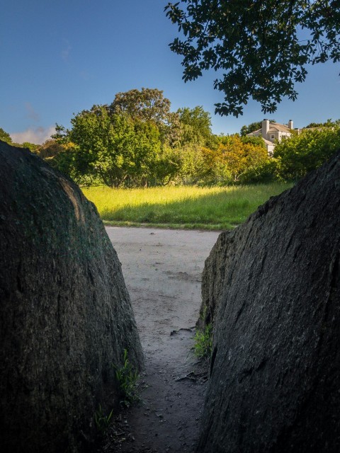 a view of a road through two large rocks