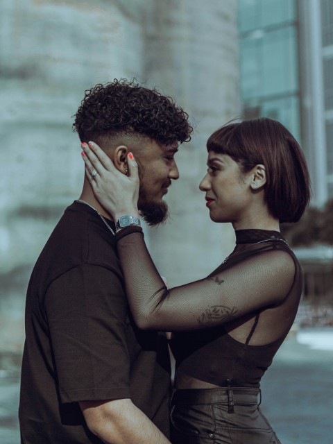 a man and a woman standing next to each other _R