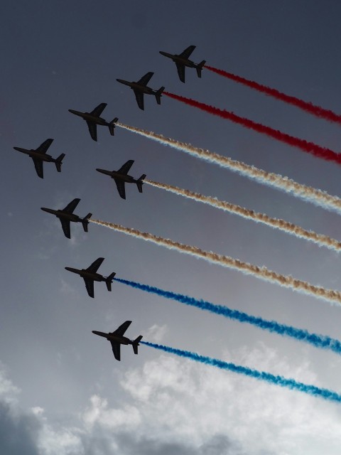 a group of airplanes flying in formation in the sky