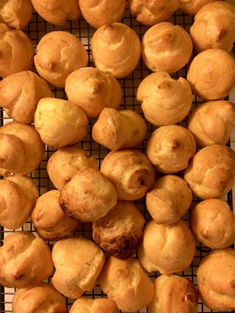 a bunch of doughnuts sitting on a cooling rack