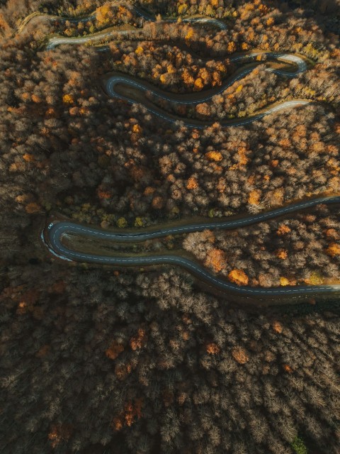 a pair of black glasses on a black surface