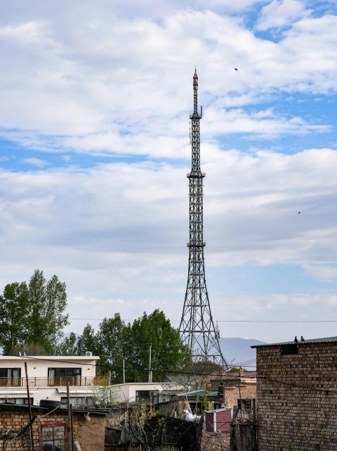 a very tall tower towering over a city