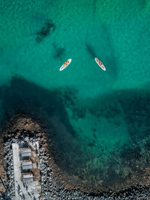 two white boats on ocan