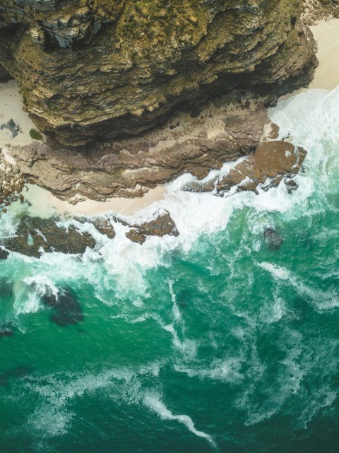 aerial photography of cliff near body of water