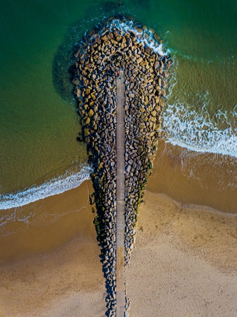 brown sand with water during daytime