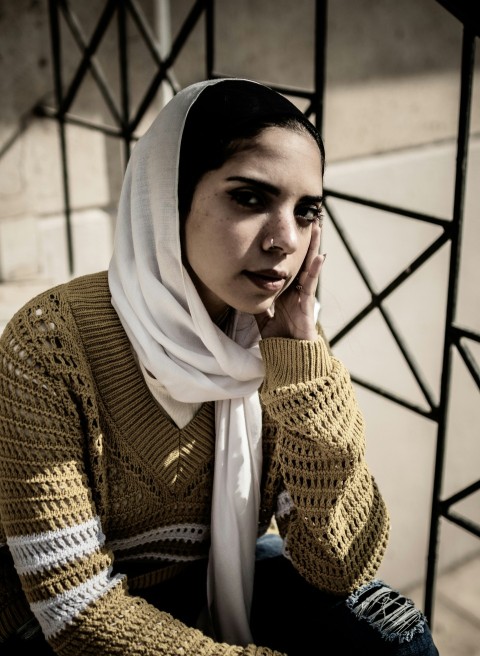 a woman sitting on a bench