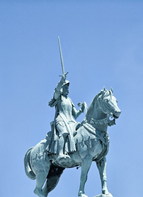 a statue of a man riding on the back of a horse