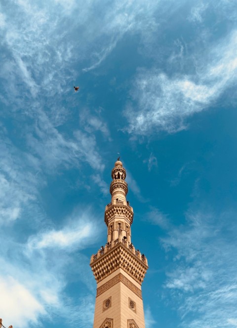 a tall tower with a clock on the top of it