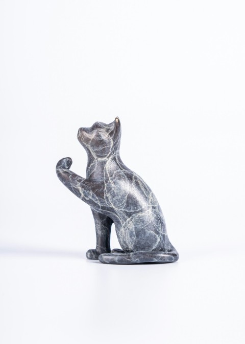 a statue of a cat on a white background