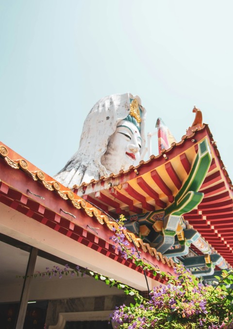 white and brown concrete statue under blue sky during daytime