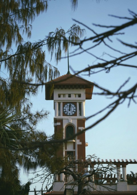 a tall clock tower with a clock on each of its sides