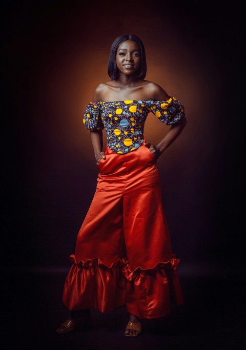 a woman posing in a red skirt and top