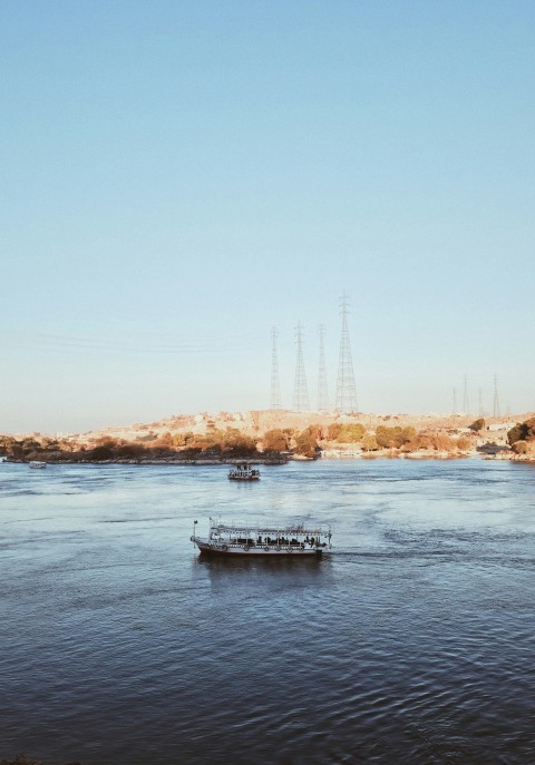 white boat on water near bridge during daytime wU6S5