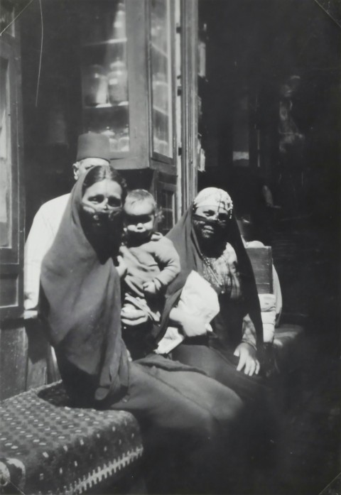 two egyptian women sitting on bench