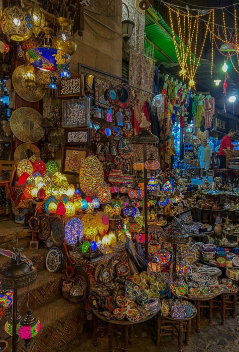 a market with lots of colorful lights and decorations