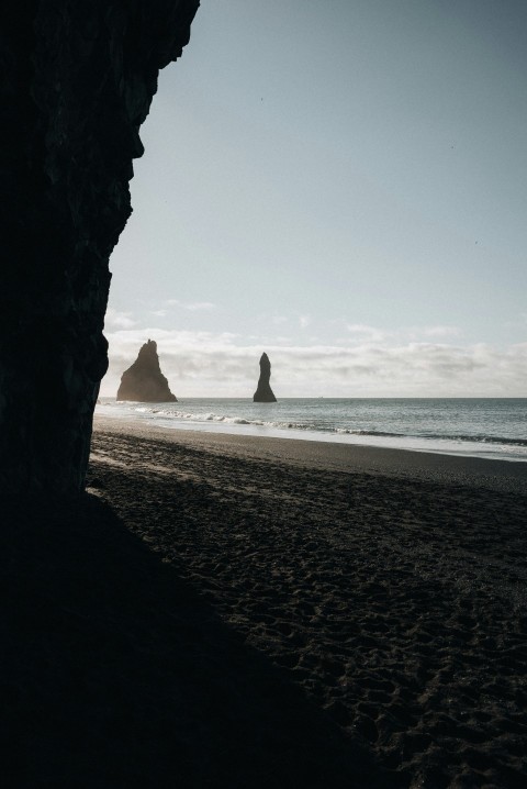 a beach with a rock formation