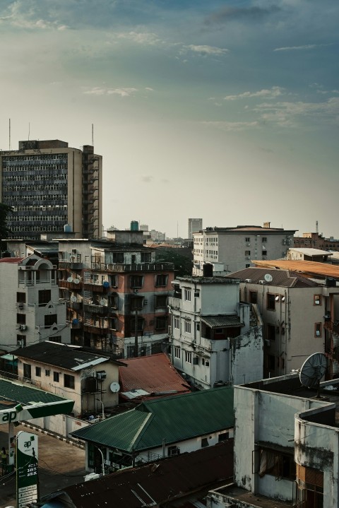 a city with lots of tall buildings and a cloudy sky