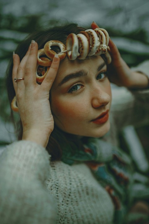 a woman holding her hair in front of her face