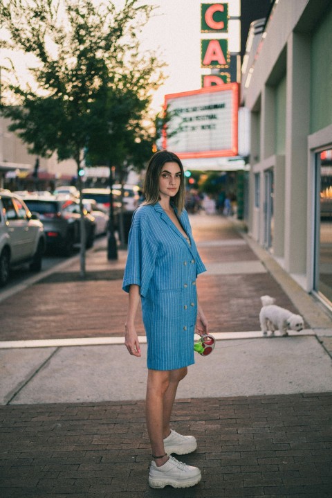 woman standing beside building _u