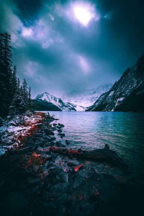 gray mountain beside body of water